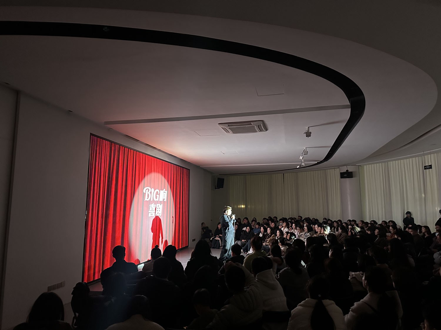 Stand-up comedy night in the second-floor glass salon